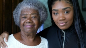 Adult woman is family caregiver for her grandmother