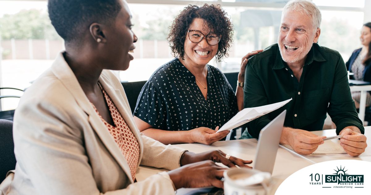 A couple talks with and advisor, representing the type of preparation that is crucial for successful senior care planning.